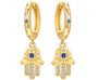The Gold Halo Evil Eye Hamsa Drop Huggie Earrings